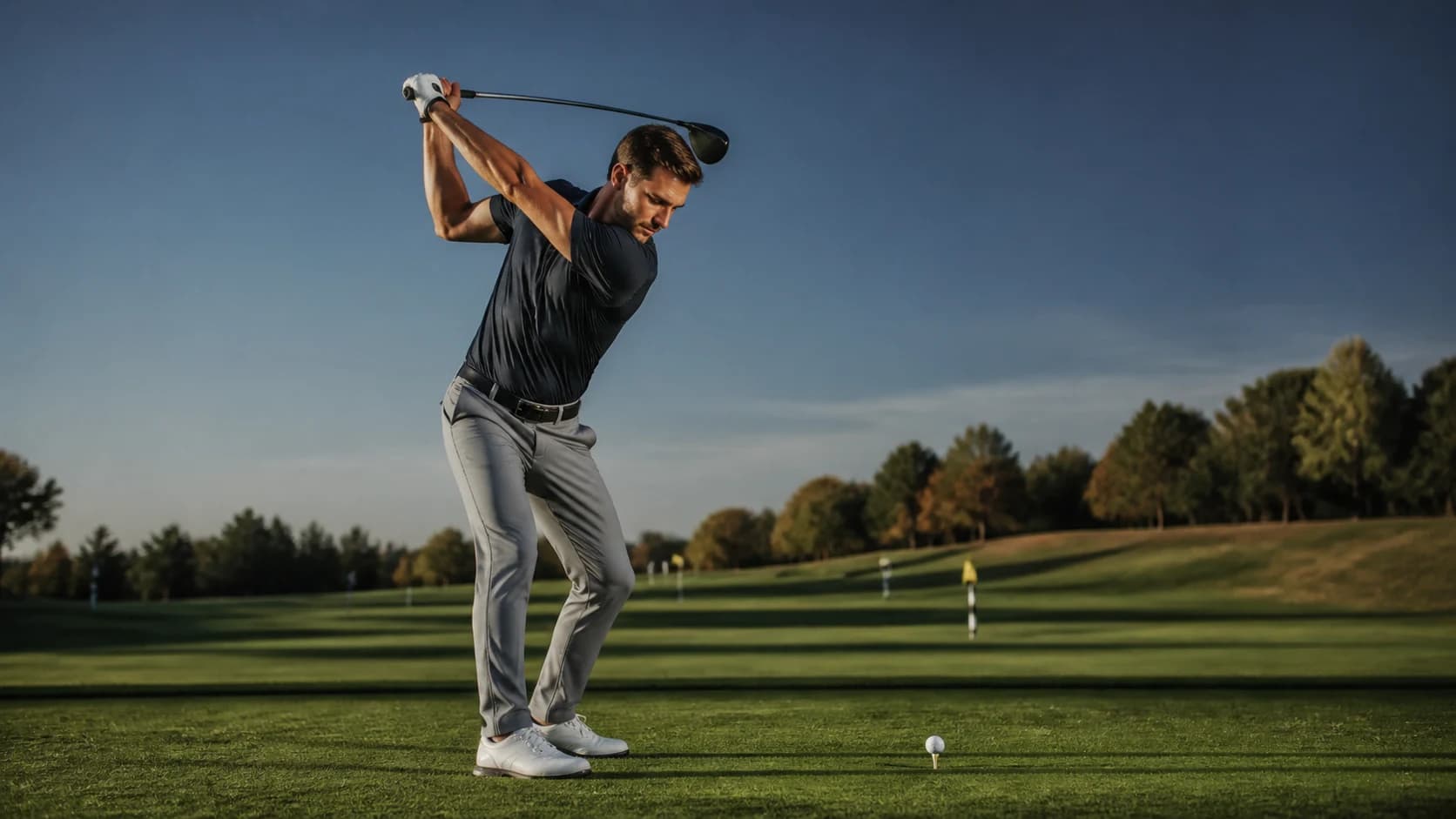 Golf athlete demonstrating drive · side view